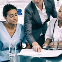Businessman and doctor talking about running practice Businessman and doctor talking about running practice