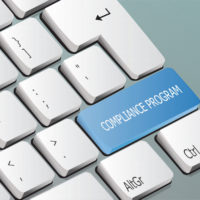 compliance program written on the keyboard button