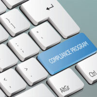 compliance program written on the keyboard button compliance program written on the keyboard button