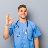 cheerful and confident showing ok gesture. cheerful and confident showing ok gesture.