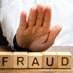 A man rejects the word Fraud with his hand. Countering deception, protection against fraudsters. The fight corruption, financial pyramids and business scams. War on crime. Cheaters A man rejects the word Fraud with his hand. Countering deception, protection against fraudsters. The fight corruption, financial pyramids and business scams. War on crime. Cheaters