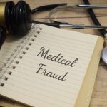 Medical fraud wording with stethoscope and gavel. Law concept