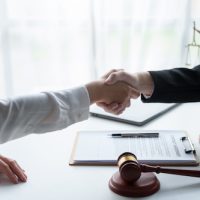 doctor shakes lawyer hand