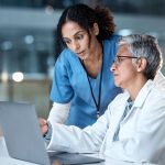 Doctors, thinking or laptop in night teamwork, medical research or surgery planning in wellness hospital. Talking, nurse or healthcare women on technology for collaboration help or life insurance app. Doctors, thinking or laptop in night teamwork, medical research or surgery planning in wellness hospital. Talking, nurse or healthcare women on technology for collaboration help or life insurance app.