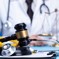 Stethoscope and justice mullet hammer is law protection for medical doctor to diagnose exam patient and lead to death. Hospital Insurance consider judgement safety with lawyer court judge, copy space Stethoscope and justice mullet hammer is law protection for medical doctor to diagnose exam patient and lead to death. Hospital Insurance consider judgement safety with lawyer court judge, copy space